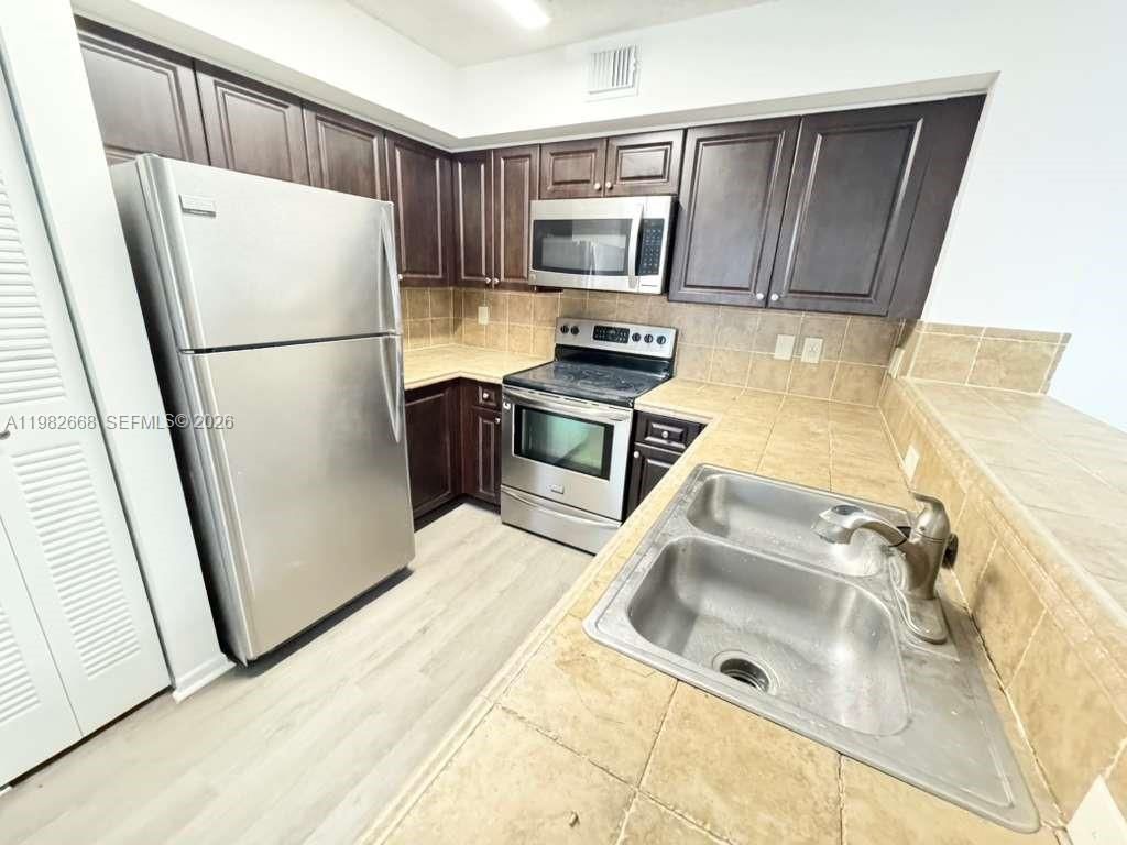 Photo of 1733 Village Blvd #208, West Palm Beach, FL 33409 (MLS # A11982668)