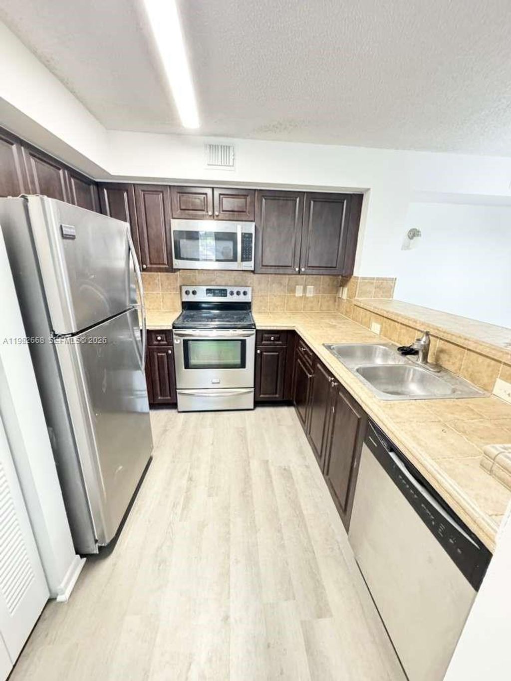 Photo of 1733 Village Blvd #208, West Palm Beach, FL 33409 (MLS # A11982668)