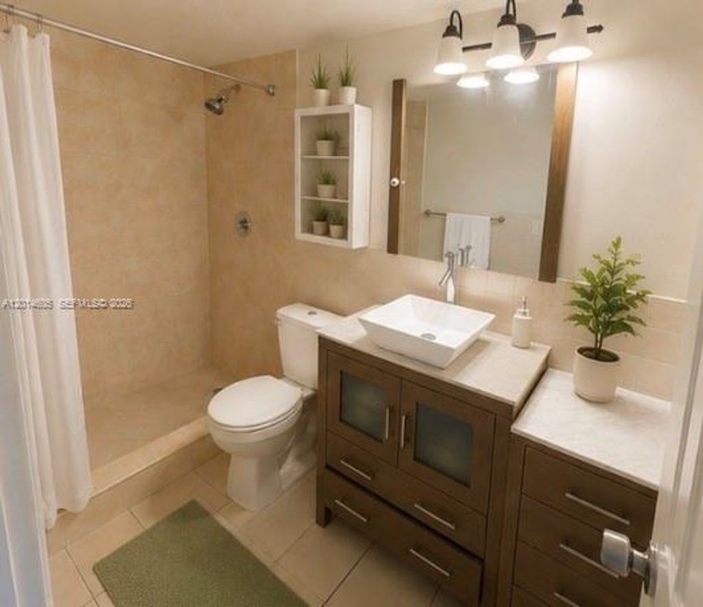 Photo of 651 NW 42nd Ct #214, Deerfield Beach, FL 33064 (MLS # A12014605)