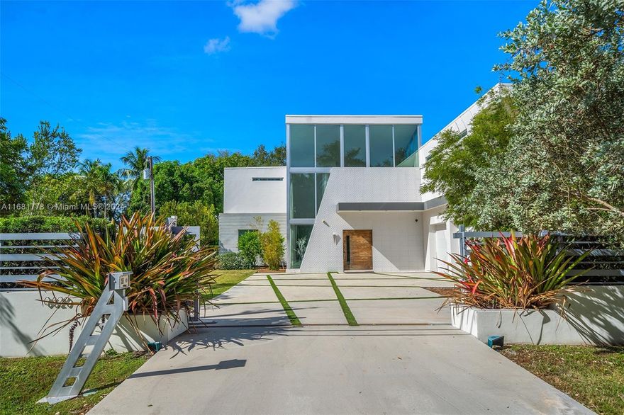 In the Heart of Pinecrest, this Stunning Gated Estate is Designed for Those Who Seek Sophistication, Privacy, and Family-Friendly Living. This State-Of-The-Art Smart Home Boasts Six Beds, Five Baths, a Media Room, Office, and a Three-Car Garage with EV Charging, All Within 8,200 SF of Sleek, Contemporary Design. The Gourmet Kitchen Features Custom Italian Cabinetry, Quartz Counters, and High-End Appliances. A Floating Wood Staircase Leads to a Lounge and Lavish Primary Suite. Outdoors, Enjoy a Summer Kitchen, Pool, and Expansive Terrace—Perfect for Entertaining. Minutes from Top-Rated Schools - Gulliver and Palmetto HS. Schedule Your Private Tour Today!