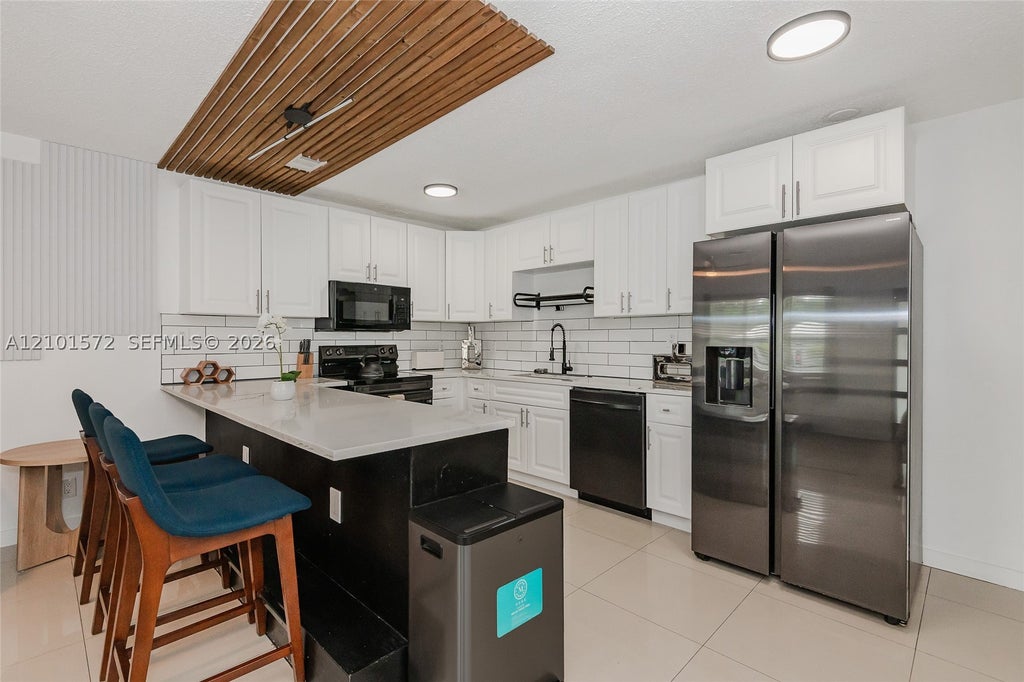 Photo of 709 SW 14th Ct #1-2, Fort Lauderdale, FL 33315 (MLS # A12101572)