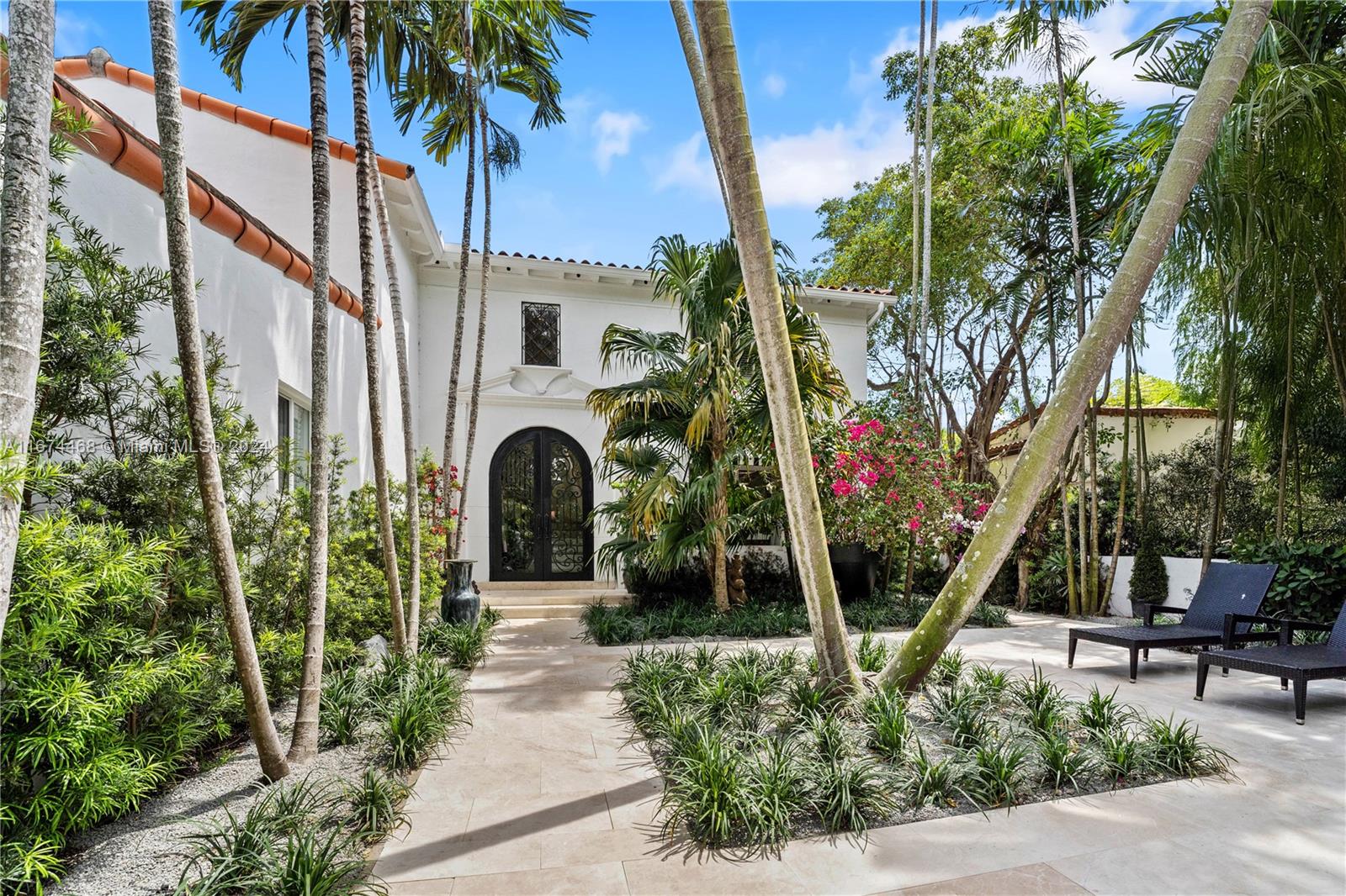 Welcome to Coveted Upper North Bay Road, Miami Beach’s most exclusive address in La Gorce Subdivision. Just blocks from Fisher Park, Lakeview and La Gorce Country Club. Enter this gated Russell Pancoast home through a stunning front courtyard with lush tropical landscape. A true private oasis with four oversized rooms, and 4.5 marble baths, generous outdoor space and heated pool with marble patio. Primary Suite has mini bar, double sinks, soaking tub, bidet and shower. Double height foyer, built-ins and Carrara marble accents. Custom bar and Chef’s kitchen with island and natural gas cooking, Formal Dining. Breakfast Room. Summer kitchen. Impact doors. Two car garage. Spacious layout and well-designed floor plan for family living! Close proximity to Lakeview Park!