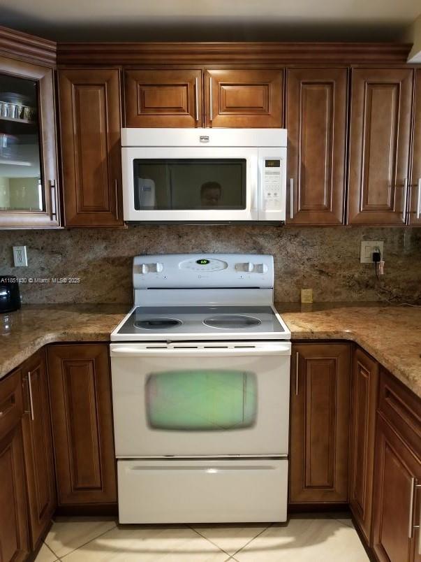 EXTRAORDINARY UNIT WITH 1400 SQ FT OF LIVING SPACE. 2Bed/2Bath, COMES WITH A NEW UPGRADED GORGEOUS OPEN KITCHEN WITH APPLIANCES, HARDLY USED NEW Ac CERAMIC TILE FLOORS THROUGHOUT. OPEN BALCONY WITH GRACIOUS CITY AND POOL VIEWS. CLOSE TO BEACHES, SHOPPING AND HOUSES OF WORSHIP. EASY ACCESS TO A1A, BISCAYNE BLVD, AND I-95. MINUTES FROM THE FAMOUS AVENTURA MALL, GULFSTREAM, AND MARDY GRAS CASINOS. PLENTY RESTAURANTS AND SUPERMARKETS IN THE NEIGHBORHOOD. THE OLYMPUS COMPLEX COMES WITH TWO HEATED POOLS, TENNIS, AN UPGRADED EXERCISE ROOM WITH MODERN EQUIPMENT, A COURTESY CITY BUS, 24-HOUR VALET AND FRONT DESK. YOU WILL THINK YOU LIVE THE LIFE OF THE RICH AND FAMOUS. BRAND NEW PARK A BLOCK AWAY. HOA REQUIRES A MINIMUM 700 CREDIT SCORE AVAILABLE 10/1