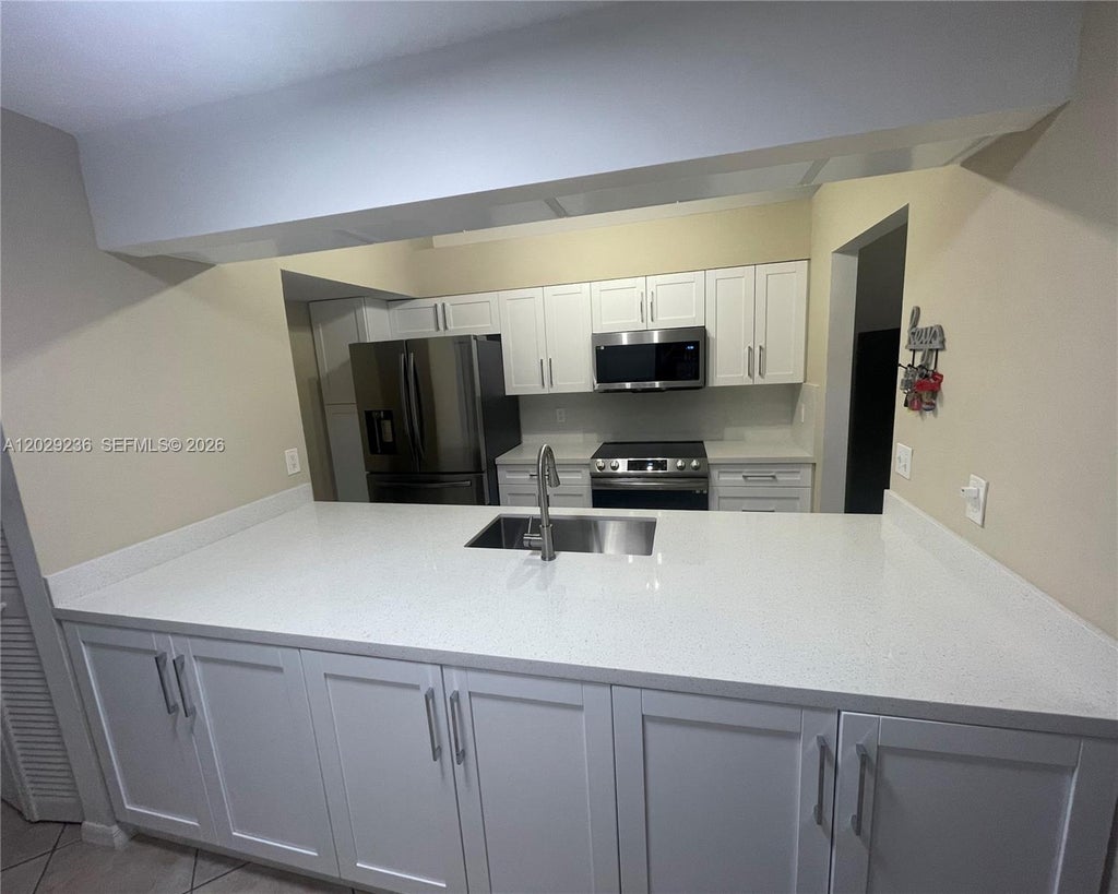 Photo of 12351 NW 11th Ct, Pembroke Pines, FL 33026 (MLS # A12029236)