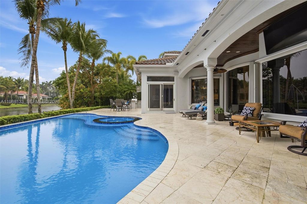 Photo of 611 Sweet Bay Ave, Plantation, FL 33324 (MLS # A11988133)