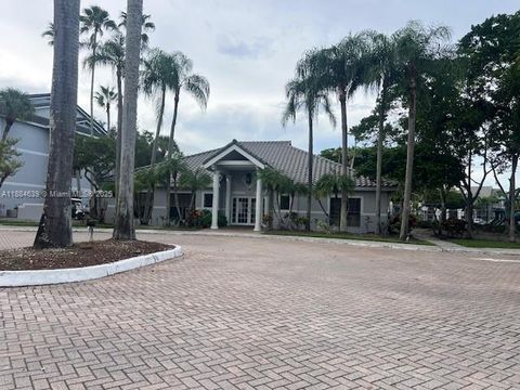 Photo of 11295 W Atlantic Blvd #107, Coral Springs, FL 33071 (MLS # A11884639)