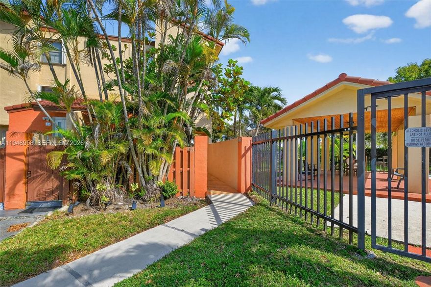 Great Location ear FIU, Dolphin Mall, Doral, etc..  First floor condo, 1-story (No stairs), 3/2, corner unit for privacy, 1,402 sqft., open layout, impact glass/storm resistant sliding doors, huge laundry & storage room, washer & dryer (regular size).  Main Suite has a spacious walk-in closet.  Big Kitchen with snack counter and window facing a very cozy front porch, home has also an oversized wrap around covered terrace in back patio with a nice and relaxing garden view not far from a lake for a nice nature walk..  Feels like a single family home is included in association monthly payment.  Amenities: Tennis Court and a nice community swimming pool close to the unit.  Association only allows 2 cars per unit (1 Assigned + 1 parked in visitors).  Plenty of guest parking.  Near FL Turnpike, 836 Dolphin Expressway & 826 Palmetto HWY.,  Golf Courses, 22 min. apprx. from Miami Airport & more...  Great Schools and Not aFlood Zone (X).  Call Listing Agent for a private appointment.  Condo has No Reserves.  25% down purchase.  Working on bldg. recertification.