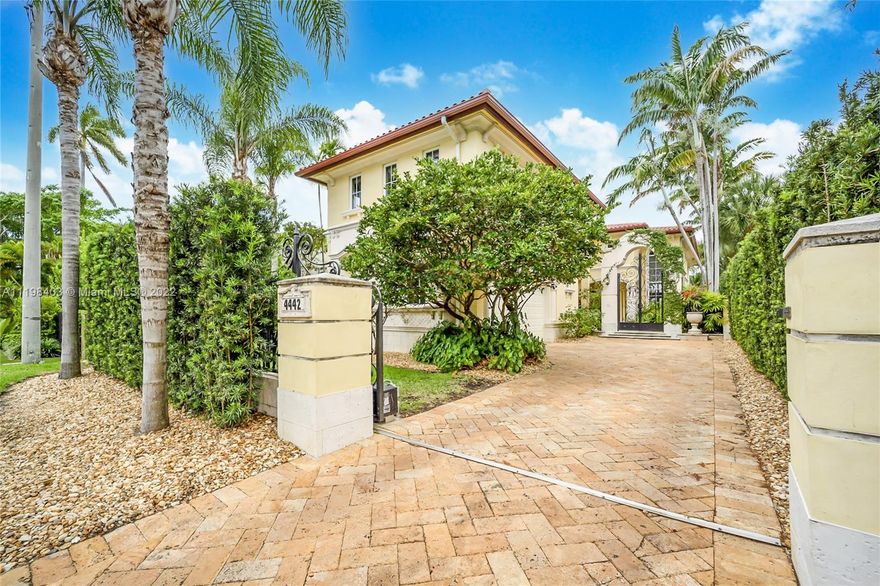 LOWEST PRICED waterfront home in Miami Beach! Beautiful Mediterranean built in 2005, situated on a 9,248-SF lot with 46 feet of waterfront and a central Miami Beach location. Enchanting courtyard will lead you inside a formal entry foyer and living areas with soaring double-height ceilings, fireplace, arched windows, gourmet kitchen with a family room, and more. Upstairs, wood floors throughout, waterfront master suite plus a second mega-size master suite with a separate staircase on opposite side, and additional 2 guest bedrooms. Downstairs, 2 guest bedrooms, one of them with a separate entrance – ideal for guest room. Enjoy glorious sunsets from your backyard with covered patio, large pool, spa, and dock. Property is gated with a 2-car garage.