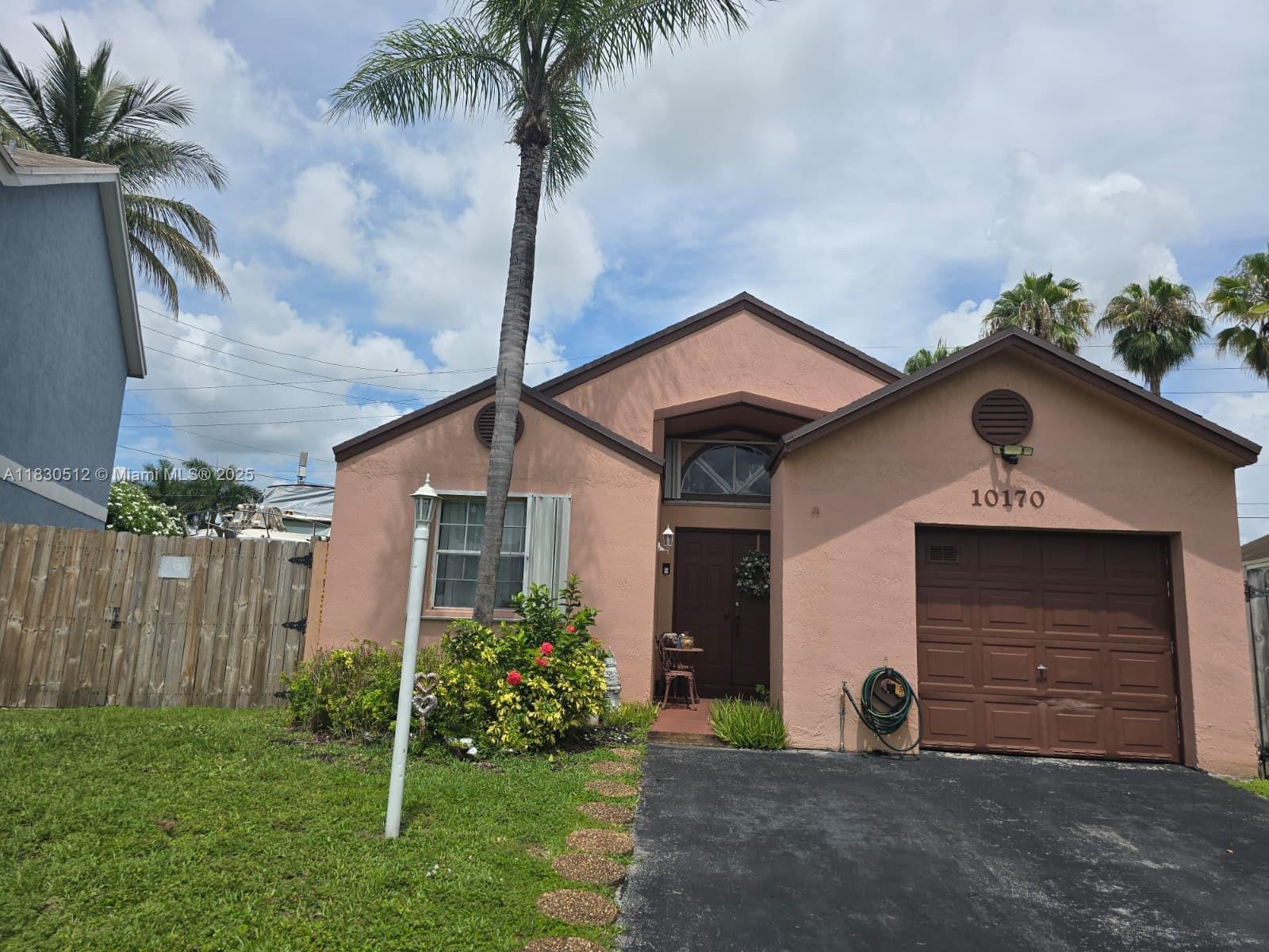 **Largest lot in the block with huge outdoor patio with room for a large boat or more parking spaces! Do not miss this opportunity to live in this wonderful laid out 3B/2B. The house has solar panels for extremely low electricity bill. Accordion Hurricane Shutters. Home features stainless steel appliances. Large ceilings. There is extra space in the garage conversion can be used as an extra room,office/den,nursery/playroom or Ba).The property is fully fenced with a huge backyard with room for a shop/storage shed. Master bedroom includes walk-in closet and reg. closet. Completely remodeled bathrooms. Huge family room. You will enjoy this beautiful home located in Catalina West which will make a great home for your family. Motivated Seller.**