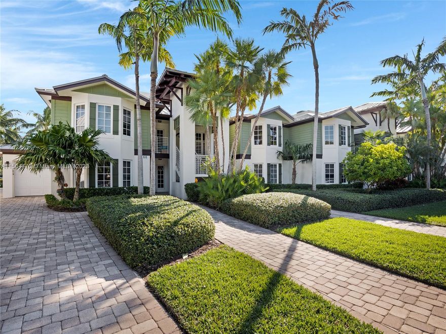 This 2-bedroom, 2-bathroom condo in Angelfish Cay offers a spacious living room and is situated on the top floor. The open floor concept seamlessly combines the beautiful kitchen with its center island, dining area, and living room that overlooks the pool and canal. For boat enthusiasts, there's convenient access for boats up to 36 ft. along the seawall, with dockage available based on availability. The condo complex features an infinity pool thoughtfully designed with both upstairs and downstairs entertainment areas, creating the ultimate sanctuary for relaxation and socializing.  The Angelfish Cay association boasts an attractive Key West-style exterior, and it’s conveniently situated across the street from tennis and pickleball courts. This condo is truly a must-see!