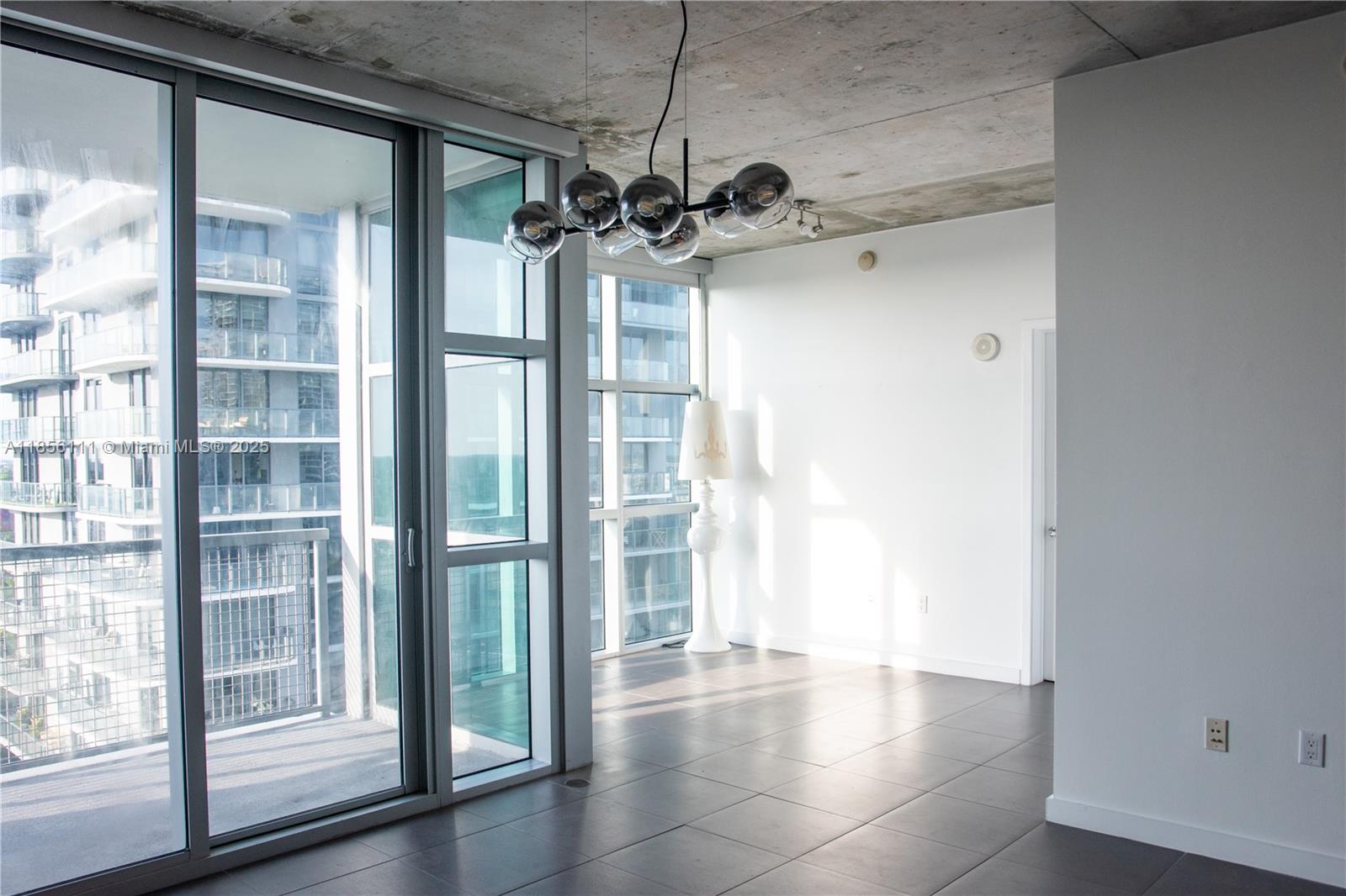 Welcome to your luxury studio loft at Four Midtown — a bright, airy space made for creatives, professionals, and design lovers. Soaring ceilings, floor-to-ceiling windows, and partial bay views set the tone, while electric blackout shades let you shift the vibe. The open layout features a sleek kitchen with high-end finishes and a spacious balcony perfect for coffee or unwinding. Located in the heart of Midtown, you’re steps from Wynwood’s edgy art and the Design District’s luxury shopping and dining. Enjoy resort-style amenities like a rooftop pool, fitness center, and 24/7 concierge. Showings via ShowingTime or text agent.