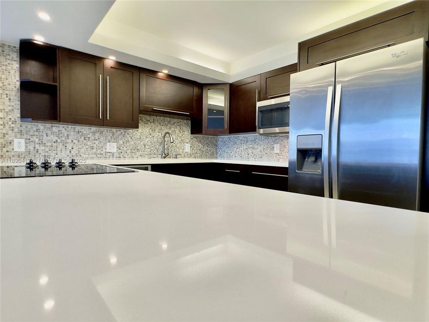 Spacious 1,000+ SqFt. Fully Renovated Residence in the Sky. Beautifully open-concept kitchen with top-of-the-line appliances and elegant quartz countertops with waterfall edges. Porcelain floors, new impact windows, and a custom walk-in closet. Rare 2 parking spaces. A true luxury building located in the heart of prestigious Aventura, the community offers 24/7 security, a staffed front desk, 2 tennis courts, 2 pools, gym, BBQ area, and much more.