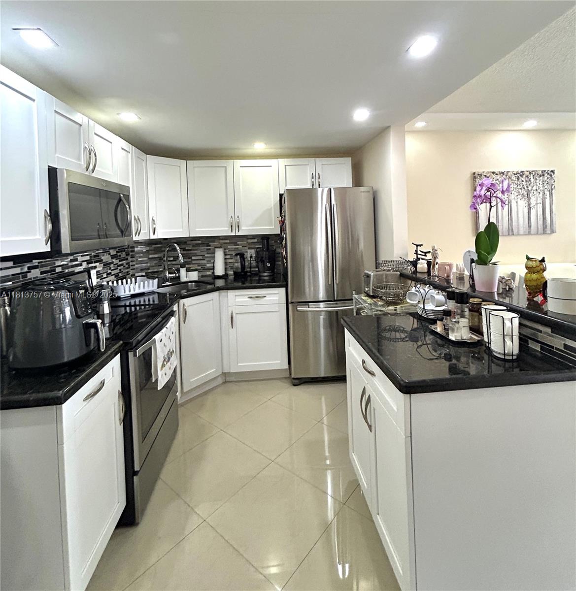 Experience coastal living at its best, steps from the sand and surf in this turnkey 1-bedroom, 1-bathroom unit. Fully remodeled and furnished—just bring your suitcase and settle in. Located on the top floor, this light-filled residence offers privacy, tranquility, and modern finishes throughout. It features a sleek, updated kitchen with stainless steel appliances, wood cabinets, and granite countertops. Enjoy a stylish bathroom and a spacious bedroom with ample closet space. Benefit from the convenience of in-unit laundry. This condo is move-in ready! Perfect as a primary residence or vacation getaway. Impact windows and a tankless water heater. A well-maintained building with a new elevator, storage, heated pool, BBQ area, and private beach access awaits you. Must see! CASH ONLY