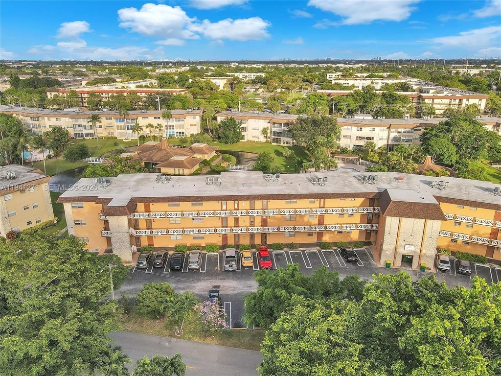 Photo of 5041 W Oakland Park Blvd #303, Lauderdale Lakes, FL 33313 (MLS # A11941271)