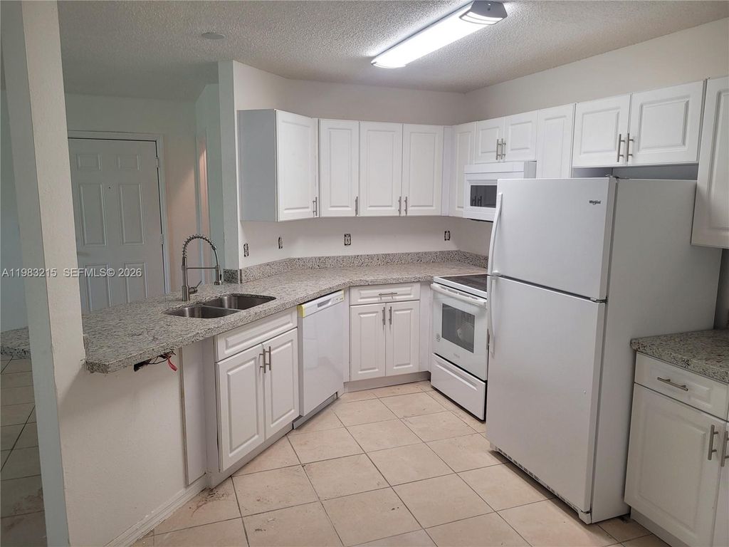 Photo of 4035 W Mcnab Rd #F103, Pompano Beach, FL 33069 (MLS # A11983215)