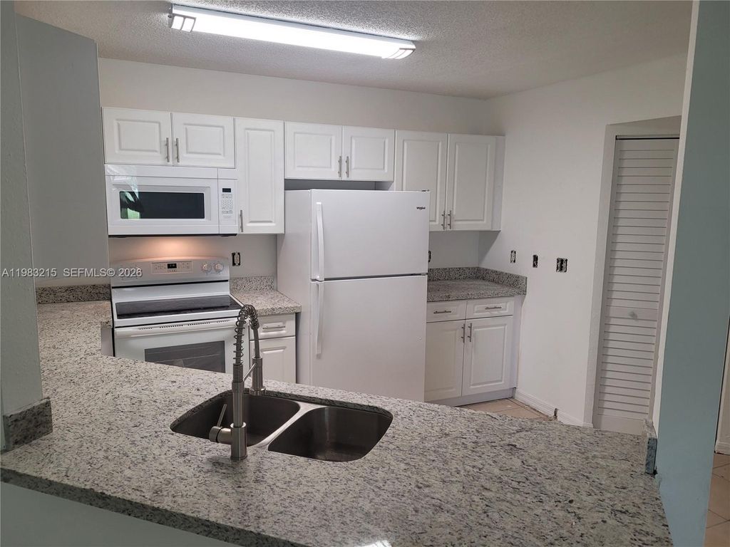 Photo of 4035 W Mcnab Rd #F103, Pompano Beach, FL 33069 (MLS # A11983215)