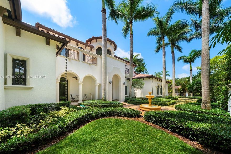 Welcome to this custom 2-story Coral Gables residence. The grand entrance ft. a charming garden w/ a fountain, leading to a majestic front door. Inside, high ceilings & a chandelier greet you to a dining & living area with a fireplace, made w/ hand-crafted natural stones, walnut, & cedar finishes. The space includes a wet bar, wine cellar, & an office/entertainment rm. The expansive kitchen, w/ wood cabinets & marble countertops, opens to a family rm. The laundry rm connects to an in-law suite w/ a bathrm. The secluded primary suite offers a wet bar, a sitting area, private access to the lush backyard, & a bathrm w/ stone finishes, a hidden shower, & vanity. Upstairs, 3 bedrms ft walk-in closets, ensuite bathrms, & balcony access. The backyard ft. a pool, jacuzzi, sauna, & a 3-car garage.