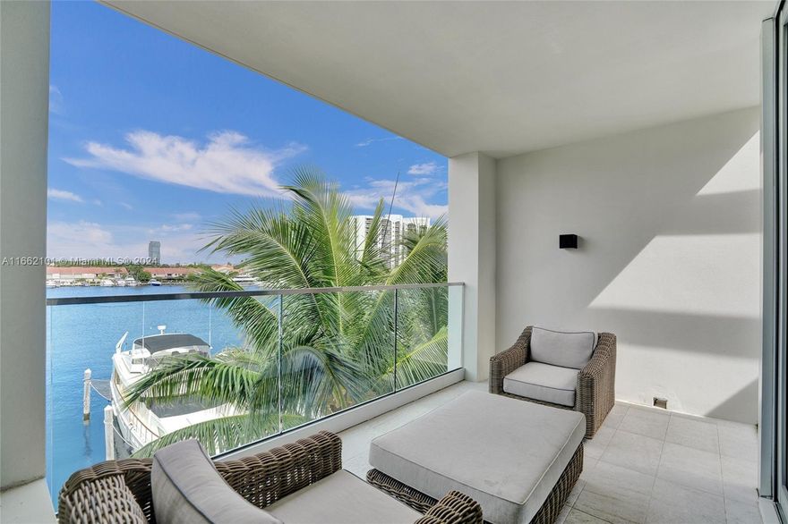 Luxury Modern Waterfront Townhome in VIDA AT THE POINT. This home offers all the luxury of a home with wide living spaces and 12'ft. high ceilings. As you enter you have waterviews of the Waterways Marina and your outdoor garden for your pleasure of entertaining family and friends. This was the designer home with furnishings and finishes by Steven G., and seller spared no expense with upgrades. You have close to 3700 sq.ft of interior living space with 4BD+Maid Quarters/5.5 BA, white porcelain floors, impact windows with views all over,electric shades everywhere, Italian kitchen,top of the line appliances and wine fridge, large terraces and sensational roof top terrace for picturesque sunset views, two car upgraded garage. Youhave aresort lifestyleThePoint offers with spa,cafe, tennis etc