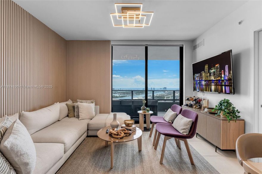 Exquisite fully furnished corner residence at Gale Miami (Natiivo) featuring 3 bedrooms, 3 bathrooms, and 1,230 sq. ft. of modern luxury. Designed by acclaimed firm Urban Robot, this home is meticulously curated with high-end designer furniture and custom décor, creating a sophisticated yet warm ambiance. Floor-to-ceiling windows flood the space with natural light and open to an expansive balcony with breathtaking views of Biscayne Bay, Port of Miami, and Miami Beach. Residents enjoy over 70,000 sq. ft. of resort-style amenities, including a pool deck with bay views, state-of-the-art fitness center, spa with sauna and steam room, co-working spaces, and multiple dining options. Located within Miami Worldcenter, steps from top restaurants, shopping, and entertainment.