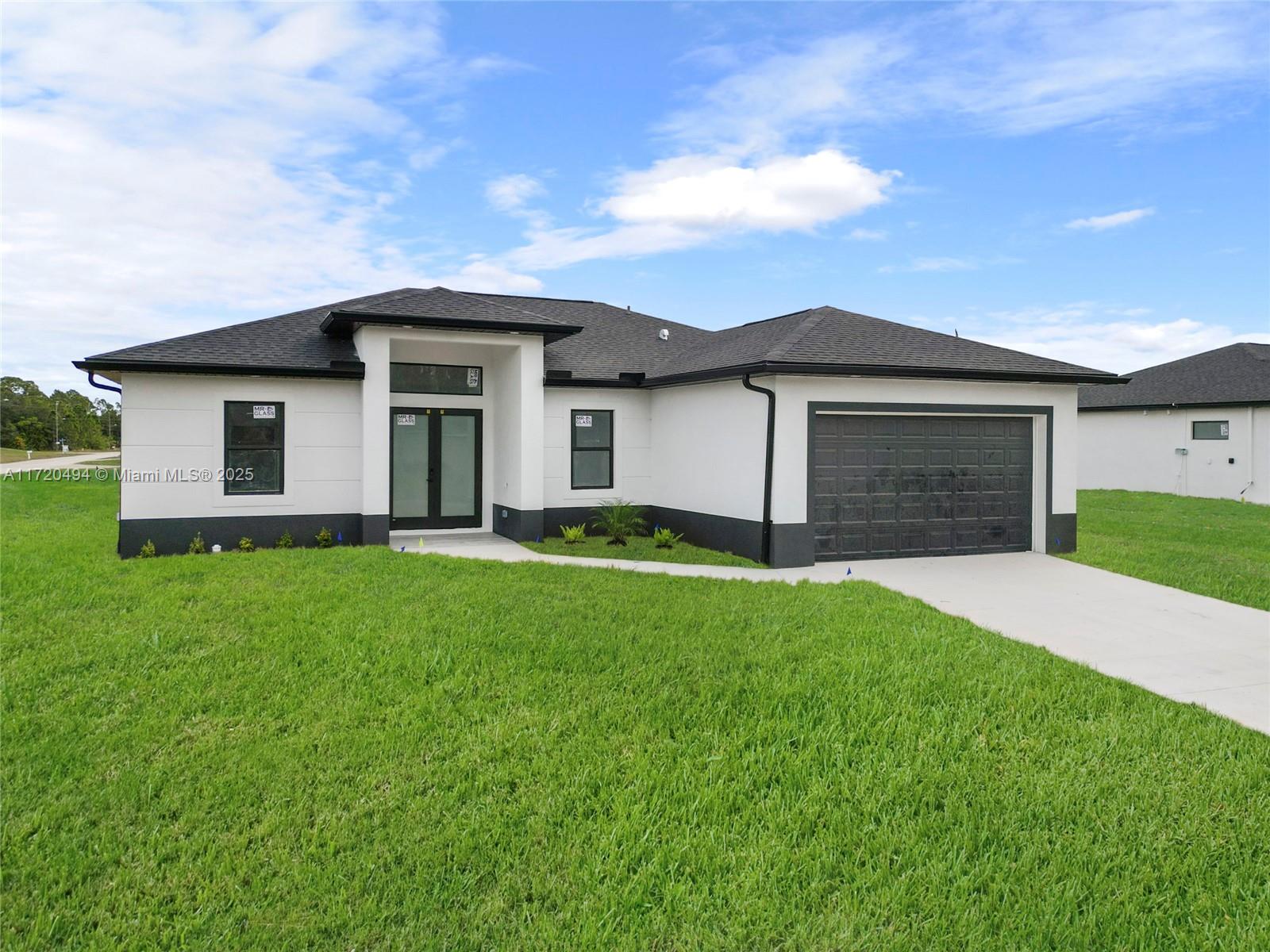 This beautiful, New single-family home features 3 bedrooms plus a Den, 2 bathrooms, a foyer, an open-concept layout, a 2-car garage, and a patio. white quartz countertops in the kitchen, and steel appliances, tile flooring throughout, adding an elegant and modern touch. Built with high-end finishes, it also includes impact-resistant windows and doors, a water filtration system, and a spacious garage for vehicles. Located in a no-HOA, family-oriented neighborhood, the home is just 25 minutes from Fort Myers and close to shopping, schools, and urban amenities in Lehigh Acres.