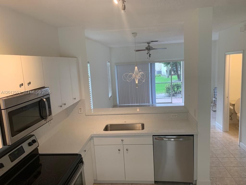 Photo of 6975 Blacksmith Way, Lake Worth, FL 33467 (MLS # A12012553)