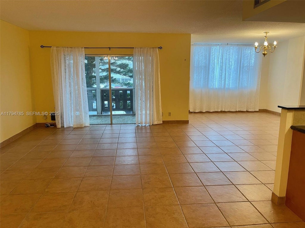 Photo of 4330 Hillcrest Dr #214, Hollywood, FL 33021 (MLS # A11794785)