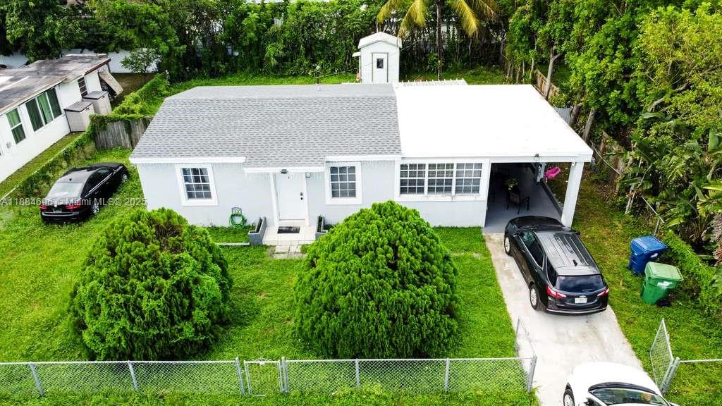 Beautifully updated single-family home in the heart of Miami Gardens, featuring a brand-new shingle roof (2025) for added peace of mind. Inside, this home offers a comfortable living space with tile floors throughout, an updated kitchen with modern finishes, and a renovated bathroom equipped with dual showerheads and a timer for a spa-like experience. The property sits on a spacious 7,500 sq. ft. lot with a fenced yard, perfect for privacy, pets, or entertaining, and also provides covered parking and a large driveway for multiple vehicles. With no HOA and plenty of outdoor space, there is flexibility for gardening, expansion, or simply enjoying the South Florida lifestyle. Conveniently located near local schools, shopping, dining, parks, and major highways.