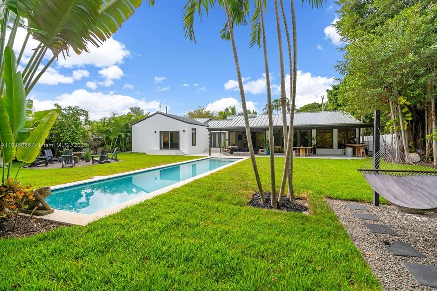Stunning modern oasis in Miami Shores, fully renovated in 2025. This light-filled home features clean contemporary lines, cathedral ceilings, Versace accent tiles, Italian ceramic bathrooms, ceramic flooring, Gaggenau appliances, Italian quartz countertops, and hurricane-impact windows/doors. Major upgrades include a 2024 metal roof, new AC, dual water heaters, and a skylight. Four parking spaces. Enjoy a zen garden, 1,100+ SF of covered decking, and a 45-ft heated lap pool. Oversized double lot, minutes to Miami Beach, Bal Harbour, and the Design District. Top schools nearby. <b>Exclusions: Dining room chandelier, all freestanding mirrors, artwork, and furniture. Seller reserves the right to remove or replace certain decorative items prior to closing. OPEN HOUSE SATURDAY 1-3PM</b>