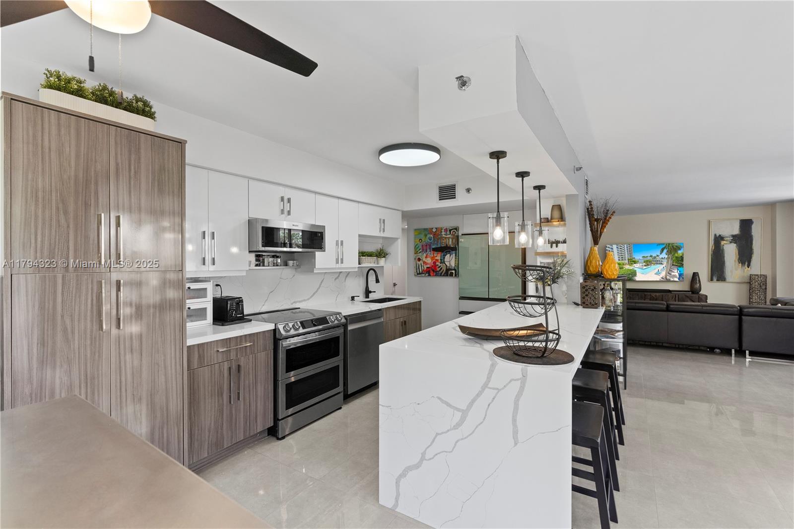 Experience luxury living in Mystic Pointe’s resort-style community with this beautifully upgraded contemporary corner unit. Enjoy stunning Intracoastal views from the expansive wrap-around balcony and natural light throughout the spacious floorplan, accentuated by floor-to-ceiling windows. Features include a state-of-the-art open kitchen, custom cabinetry, porcelain tile floors, and an elegant primary suite with spa-style bath and walk-in closet. Includes hurricane shutters, in-unit laundry, storage, and two parking spaces. Secure building with concierge, 24/7 security, funded HOA with reserves and certifications. Amenities: pool, gym, sauna, jacuzzi, tennis, pickleball, dog park, valet, EV chargers, and on-site restaurant. Minutes to Aventura Mall, beaches, and houses of worship.