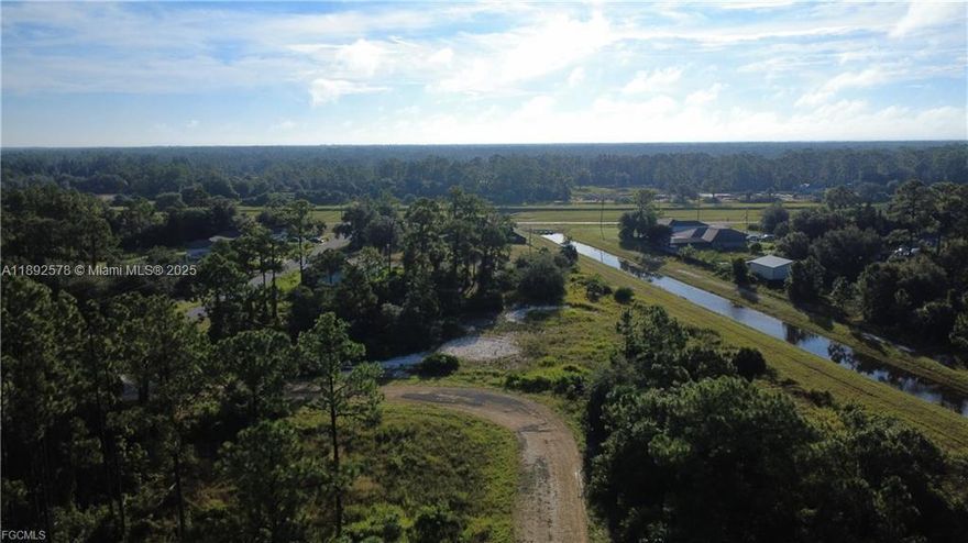 .53 Acre Commercial Lot – Zoned C-2 Perfectly positioned in desirable FEMA Flood Zone X—where lenders won’t require flood insurance—this lot is primed for your next business venture. With C-2 zoning, the property offers excellent flexibility for a wide range of commercial uses. Conveniently located near Sunshine Blvd, 59th St SW, and Lee Blvd, it provides easy access to major roads and strong commuter traffic. Most of the pine trees have already been trimmed down, and a canal sits directly behind the property, adding privacy and open space. An outstanding opportunity for investors or business owners in a fast-growing area of Lehigh Acres