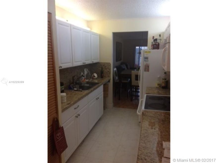 Ground Floor 2 bedroom 2 bathroom with front load washer/dryer. Granite counter top in the kitchen. Enclosed patio with a storage closet. Upgraded bathrooms. Pool directly behind the building. Take pleasure in Century Village Resort Style living community with million dollar clubhouse, 2 fitness centers, 24 hr security, 8 swimming pools, bus transportation, tennis, movies, theater, billiards, pharmacy, cafe, golf, and much more.