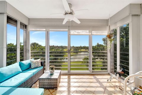 Photo of 3980 Oaks Clubhouse Dr #409, Pompano Beach, FL 33069 (MLS # A11902609)