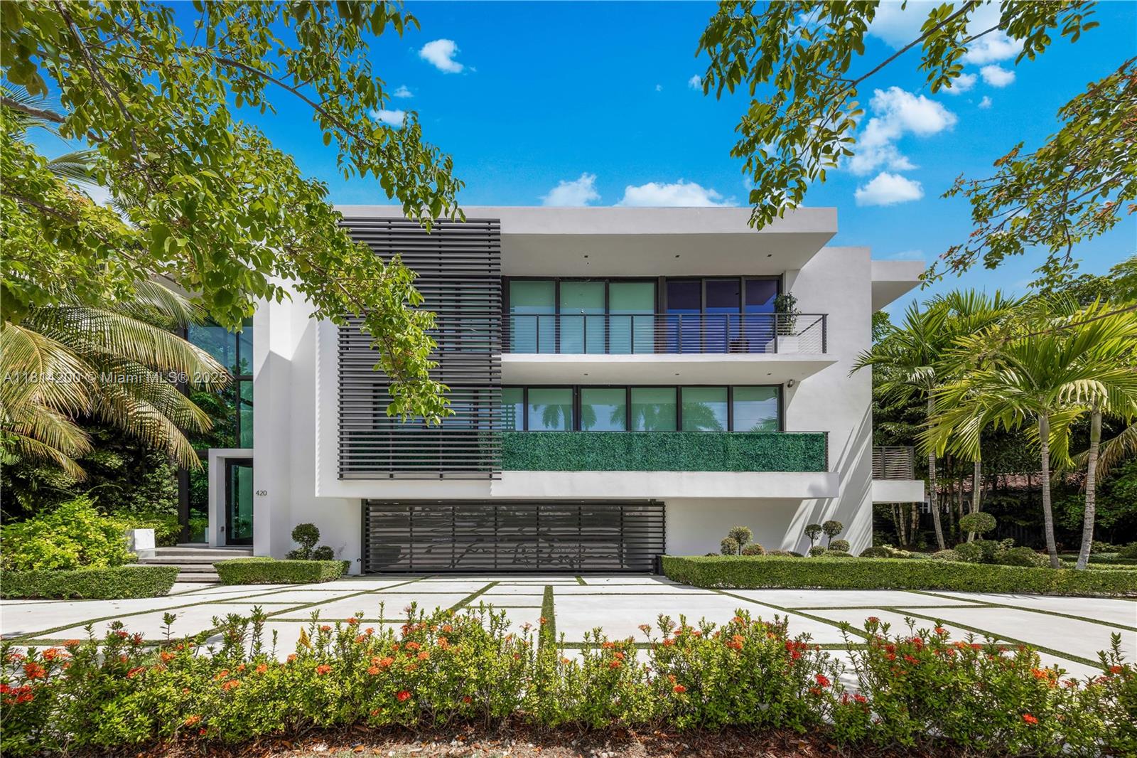 A modern masterpiece by award-winning architect Ralph Choeff, located on the coveted, guard-gated Hibiscus Island. Newly completed, this residence impresses with a dramatic 20-ft glass foyer, floating staircase, and wide-plank white oak floors. Natural light fills the open layout, blending indoor and outdoor living. The sleek Mia Cucina kitchen features Wolf & Sub-Zero appliances. Additional highlights include an Apple smart home system, private elevator, gym, and sauna—offering elevated comfort and ease. The expansive primary suite includes dual en suite baths and custom walk-in closets, while the rooftop terrace captures 360° views of the Miami skyline. Priced at the lowest price per square foot on the islands—exceptional value in one of Miami Beach’s most exclusive enclaves.
