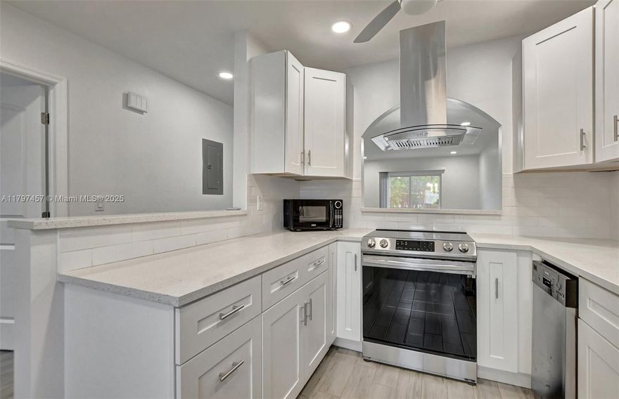 Recently renovated one story condo.2 Bedrooms & 2 full Bathrooms. New stainless steel appliances...All new flooring thru-out the condo. New installed white kitchen. Quartz countertops. Airy kitchen open walls with a arched pass thru wall...which gives a nice architectural look...Pantry cabinet with pull out shelving. New Hurricane windows. Master Bedroom has his/her closets for extra storage. Serene lakeview surrounding Master Bedroom and Living Room. Open patio to enjoy the canal that Florida weather provides. Tankless water heater. New electrical circuit panel box installed to replace the Federal Pacific panel box. Full size washer/Dryer...Convenient location minutes to shopping, Florida Tpke & I-95. 55+ community, at least one of the owner must be 55+, HOA required 700+ credit score