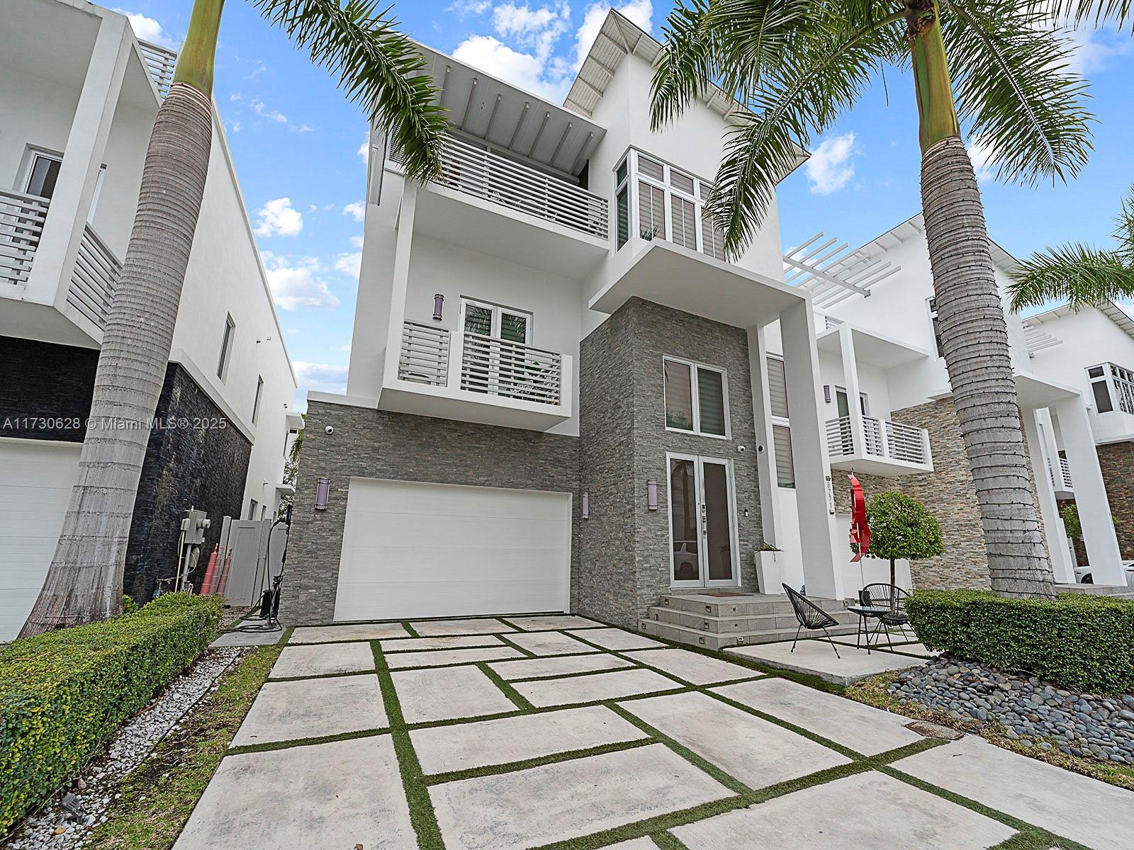 Live in style in the exclusive Oasis Park Square at Doral community! This tri-level home is impeccably renovated & loaded with premium features: a private heated pool, a chic glass wine cellar, & a chef’s kitchen outfitted with S.S appliances. The over-sized master suite offers a spa-like bathroom & a generous walk-in closet. All other bedrooms offer the privacy of its own ensuite bathroom. With dual A/C units, this home ensures ultimate comfort in every corner. The crown jewel is the rooftop terrace, fully equipped with a BBQ, jacuzzi, artificial grass garden, TV, & a full bathroom—perfect for entertaining. Best of all, the home’s backyard gate gives direct access to CityPlace Doral, where a vibrant selection of restaurants & nightlife await. A perfect blend of luxury & comfort!