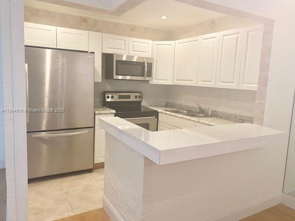 Photo of 20380 NW 7th Ave #202, Miami Gardens, FL 33169 (MLS # A11904515)