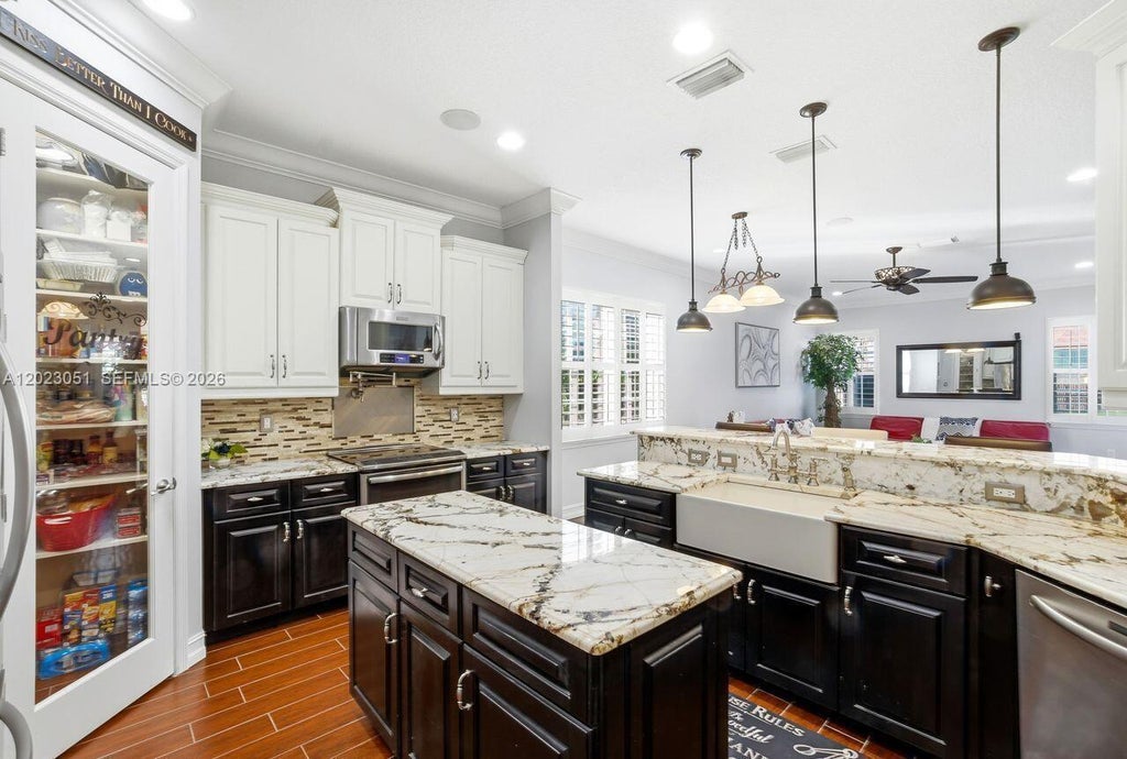 Photo of 4353 SW Otto Ct, St Lucie West, FL 34953 (MLS # A12023051)