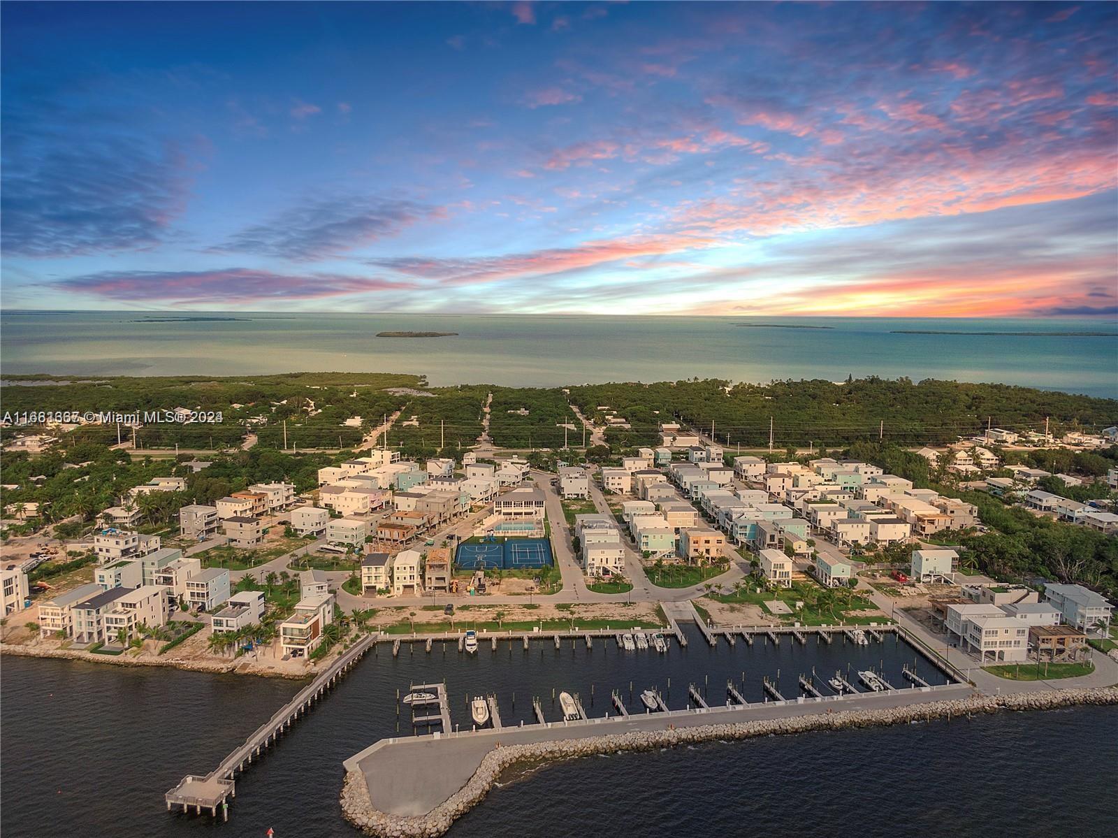 Introducing a wonderful opportunity to build your very own near waterfront home in the Upper Keys immediately (no ROGO). Located in the largely developed & quiet neighborhood of Key Largo Ocean Resort. Enjoy the luxury of accessing the open water from the community boat ramp. This prestigious golf cart community offers a large Clubhouse, Tennis, pickleball, basketball courts, Marina, low HOA's, Boat ramp, gated and patrol 24 hr security. Only a 1hr drive from the mainland offers minimal traffic from the lower keys. Once your home is built, with a rooftop terrace, you & your guests will benefit from ocean views to enjoy day or night! Come take advantage of the best priced lot available within this exclusive community.