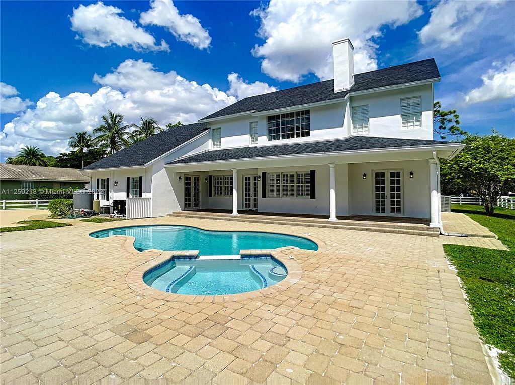 Photo of 6921 NW 63rd Way, Parkland, FL 33067 (MLS # A11259218)