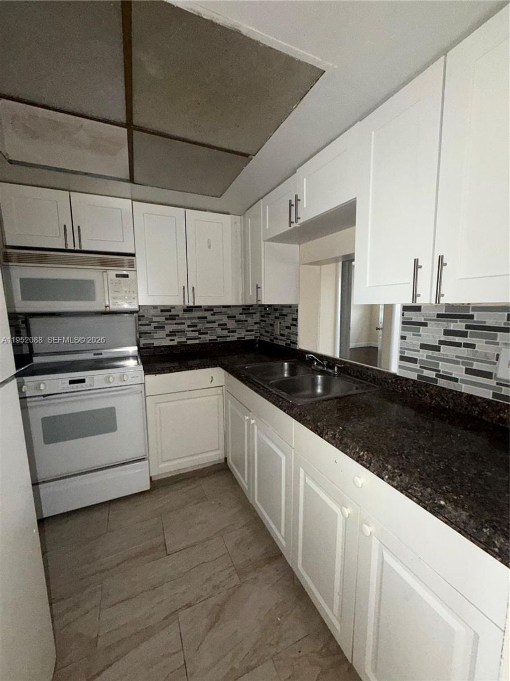 Photo of 7753 Tam Oshanter Blvd #7757, North Lauderdale, FL 33068 (MLS # A11952088)