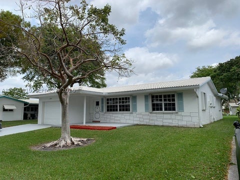 Photo of 1024 NW 90th Way, Plantation, FL 33322 (MLS # A12094919)