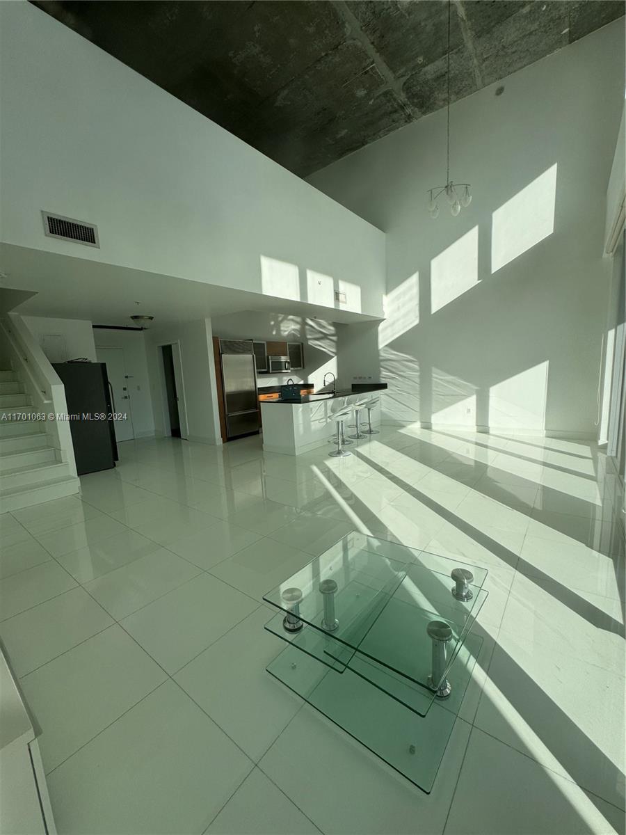 Welcome to Penthouse 203, a stunning 2-bed, 2.5-bath offering 2,451 square feet of luxurious living space in the heart of Miami’s vibrant Edgewater neighborhood.
This elegant residence features a spacious first-floor entry leading to an open-concept living area with soaring ceilings and abundant natural light. The modern kitchen is equipped with high-end stainless steel appliances, sleek countertops, and ample storage, making it perfect for both everyday living and entertaining.
Upstairs, the master suite offers a serene retreat with a spa-like en-suite bathroom and generous closet space. The second bedroom is equally well-appointed, providing comfort and privacy for guests or family members.
Step outside to your expansive private balcony, where you can enjoy panoramic skyline views.