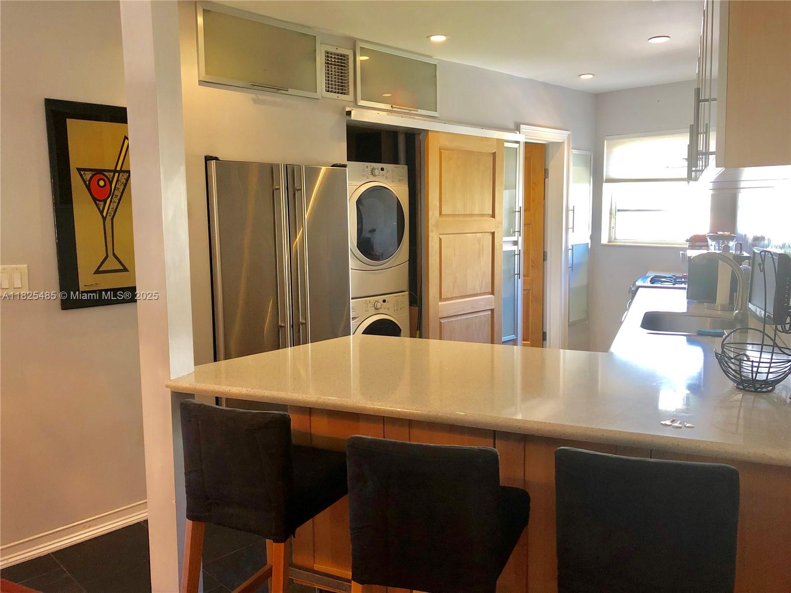 Furnished bright corner unit with amazing balcony facing the Miami Beach Convention Center. Great gourmet kitchen with full size stainless steal Jenn Air appliances, dual fuel electric convection oven with gas cook-top and warming drawer, glass range hood, French door refrigerator with filtered water, dishwasher w/ stainless interior, quartz countertops, slate floors, recessed lighting, and a peninsula for added seating. Spacious bedroom, queen size platform bed with memory foam mattress. Unit features a lot of closet space and storage. Wall mounted desk space for your home office or computer. The unit has central air conditioning and Washer and Dryer. One year lease. Good credit.