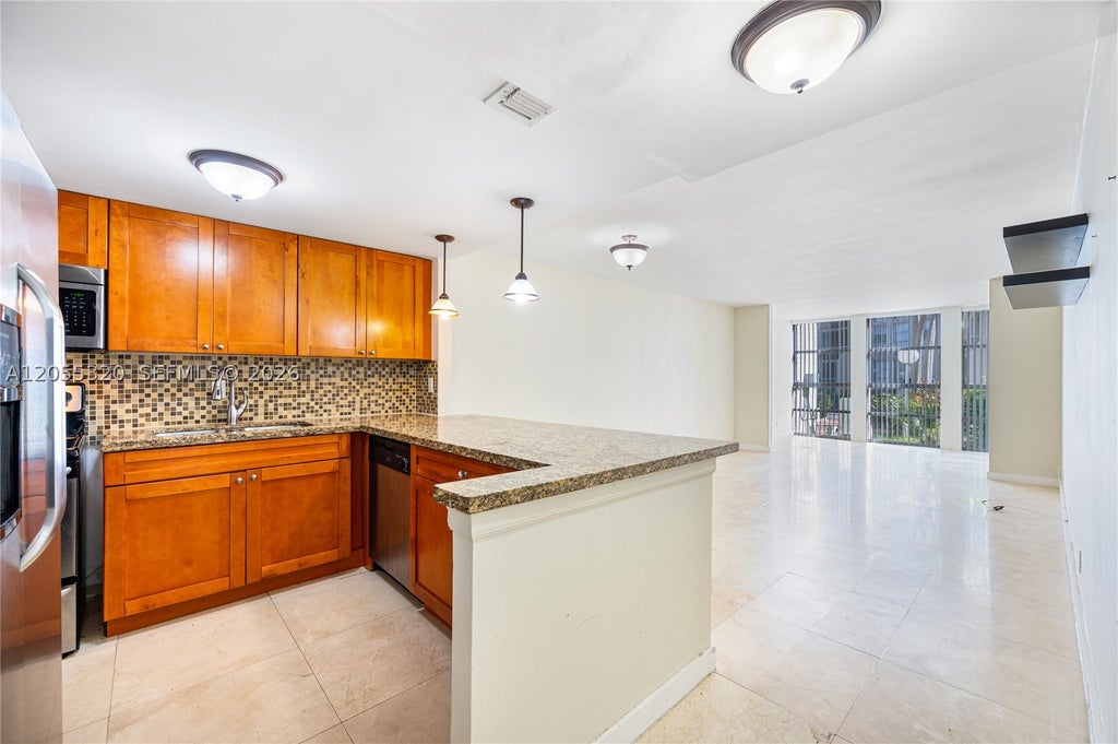 Photo of 601 Three Islands Blvd #112, Hallandale Beach, FL 33009 (MLS # A12055320)