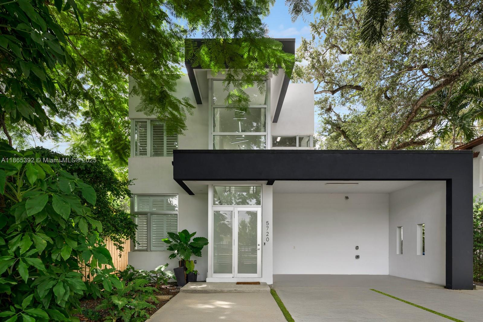 Modern 4 Bedroom, 3-Bathroom home located just one block from Coral Gables. Built only 10 years ago, this stylish residence offers high ceilings and abundant natural light, creating bright and airy living spaces perfect for any family. Features include spacious open areas, impact windows and doors, camera system, electric indoor shades, a sleek kitchen, and EV charging area.