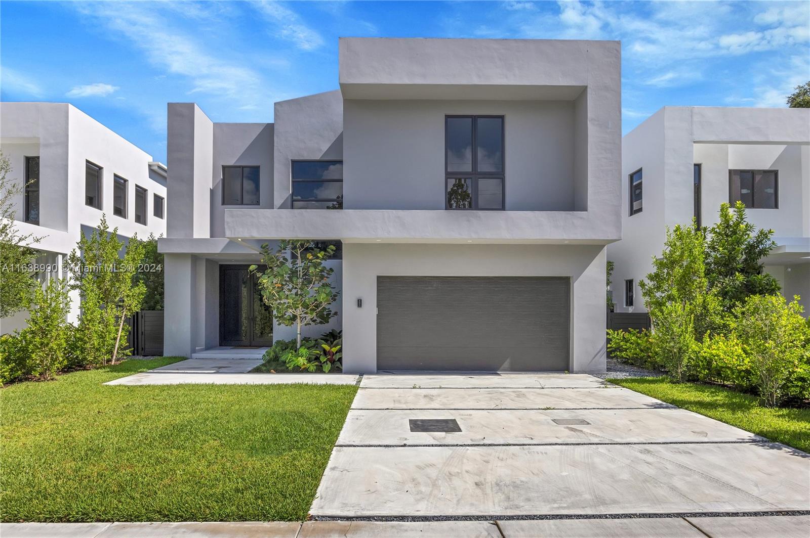 Introducing a stunning new construction marvel in the idyllic neighborhood of Ponce Davis. This 2-story, 5-bedroom, 5.5-bath home embodies tropical modernism with luxury finishes. The ground floor features a state-of-the-art kitchen with high-end finishes seamlessly connected to the family room, bedroom suite and a 2-car garage. The second floor boasts a lavish master suite with dual walk-in closets, large balcony, a spacious den, and convenient laundry room. Outside, an expansive backyard oasis awaits, complete with a stunning pool, summer kitchen, and lush tropical landscaping—perfect for both entertaining and serene relaxation. Full impact glass w/ whole-house generator + underground gas tank makes this home storm ready. Minutes from Downtown Coral Gables and The Shops at Sunset Place.