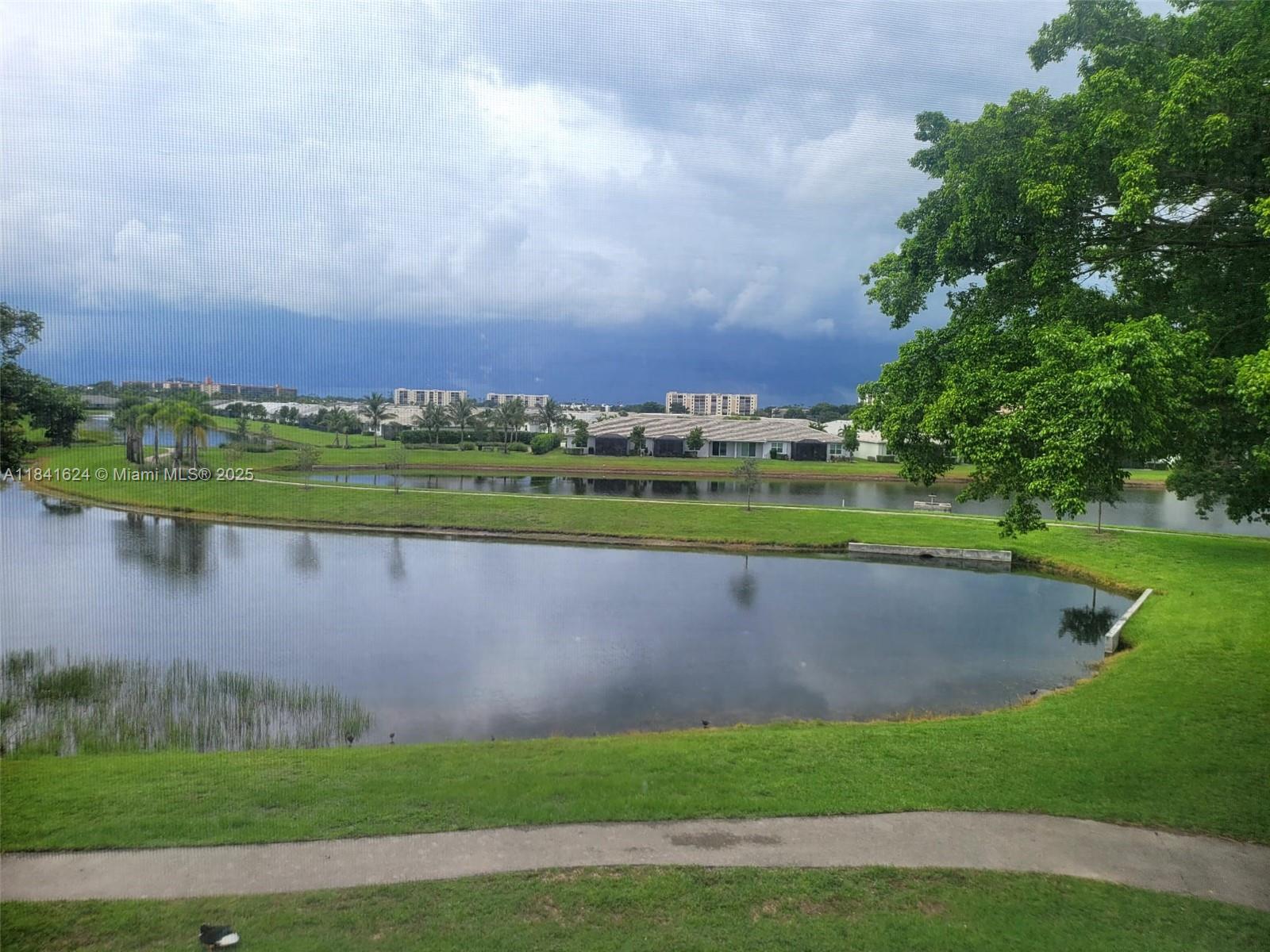 Welcome to your serene lakefront retreat! This rarely available corner unit is offered for annual or seasonal rental (minimum 4 months) in a vibrant 55+ community, enjoy a spacious, fully furnished, 2-bedroom, 2-bath, screened balcony with breathtaking lake views and stunning sunsets, the home boasts beautiful laminate wood flooring, an eat-in kitchen with a full-size washer and dryer, and a generous primary suite with an en-suite bathroom, the second bedroom is perfect for guests or a home office, experience an active lifestyle with access to walking trails, a pool, gym, and clubhouse, conveniently located near shopping, dining, entertainment, Atlantic Avenue, Delray Marketplace, the Turnpike. Annual rent is$1,950/month; short-term rent is$2,950/month. Available starting October 1, 2025.
