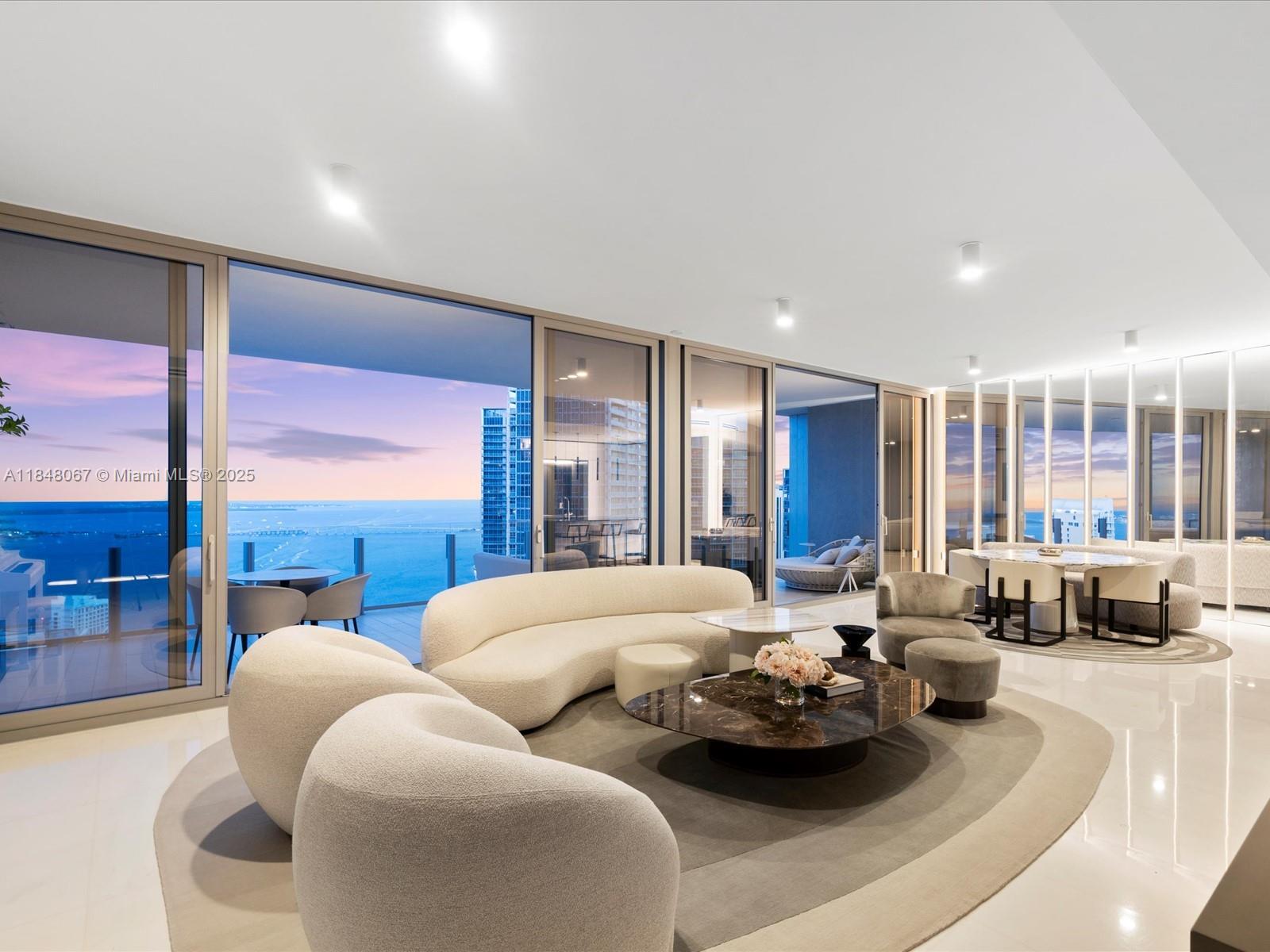 The most sleek, sophisticated, and move-in-ready unit Miami has to offer. Welcome to Aston Martin Residences #4502 where design and elegance meet endless water views. As the highest non-duplex 02 line, this 2,422 SF corner unit features unobstructed front and rear views, 3 beds, 3.5 baths, and southern exposure that floods the space with natural light through floor-to-ceiling windows. Fully finished and furnished by Britto Charette with over $640K in upgrades.
The custom kitchen flows into open living spaces with curated lighting and smart design. The primary suite boasts double vanities, rain shower, soaking tub, and custom closets. Enjoy 5-star amenities: pool, spa, sauna, gym, and 24/7 concierge. Miami luxury, elevated.
Flawlessly executed. Miami luxury, elevated.
