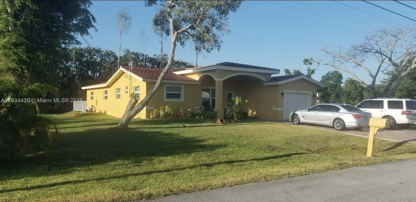This prestigious Plantation home, features an open floor concept with charming and exquisite details. Property sits on 1.25 acres with mature trees that provide the serenity and tranquility that make this home very desirable. This completely tile 4 bedroom, 3 bath with a eviting pool has all modern upgrades including hurricane impact windows and doors and more.. Minutes from Sawgrass and major shopping and entertainment. Easy to show, see broker remarks