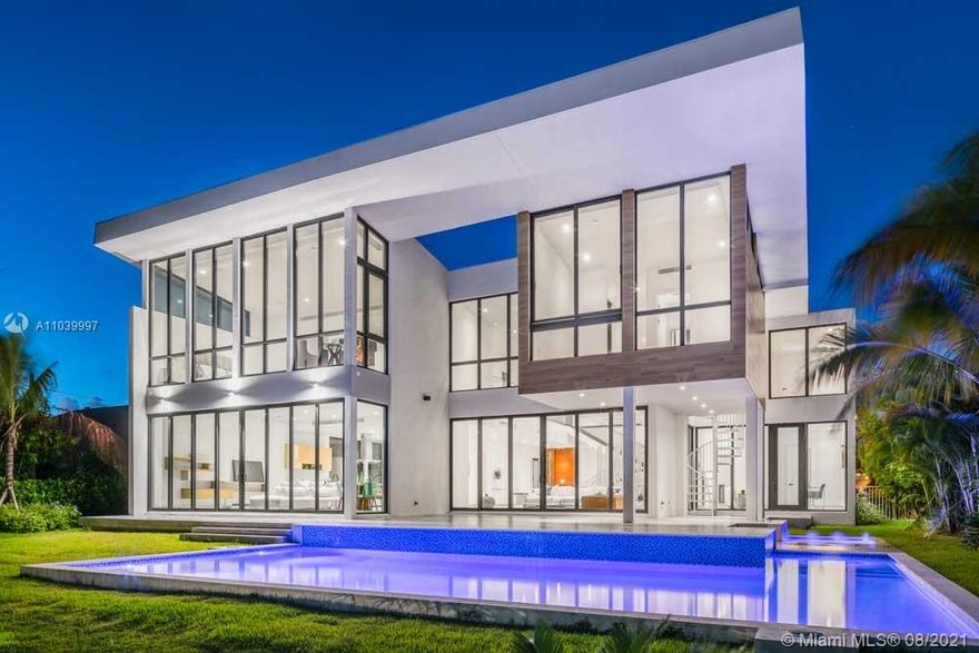 This architectural marvel is located in exclusive gated Golden Isles, home features 6 bedrooms and 6 baths, and resides on an oversized 12,750 sqft lot. Double-height ceiling, floor-to-ceiling glass throughout every room, white-washed wood floors and Porcelanosa stone flooring. 50 ft long swimming pool and 85 Ft of water front. Close to the beach, golf course, Gulfstream shops and Aventura Mall makes this an exceptional home.